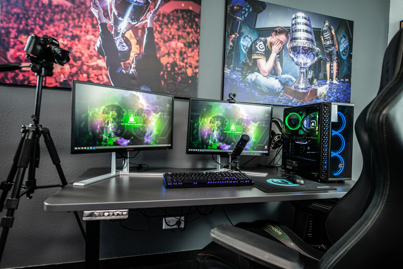 Streaming desk with multiple monitors and a camera